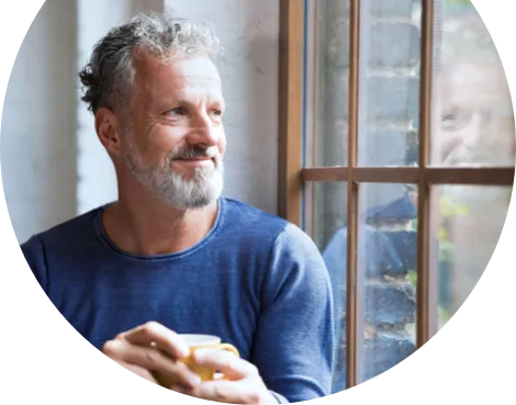 Picture of a man looking out the window