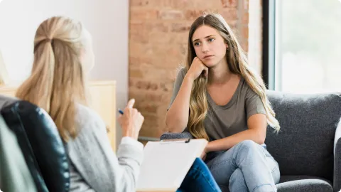 Neuorfeedback Provider talking with a teen about her anxiety attacks